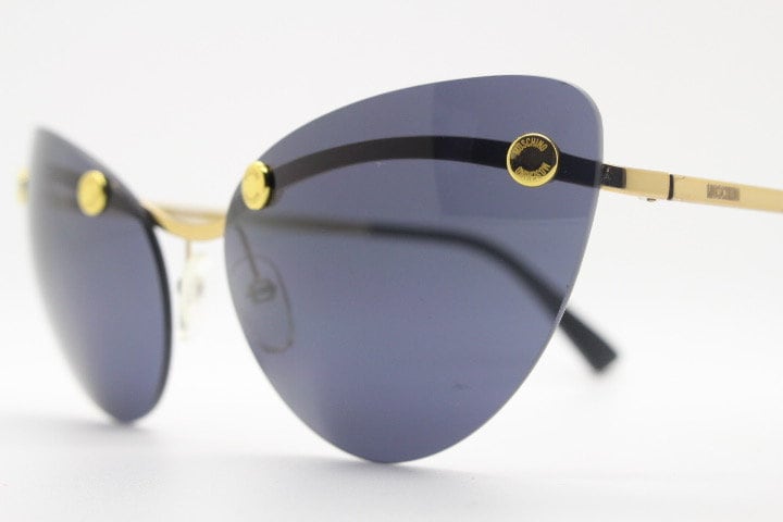 Moschino oval cat eye sunglasses model 082/S. Womens frameless cateye in perfect proportions with golden metal brow line