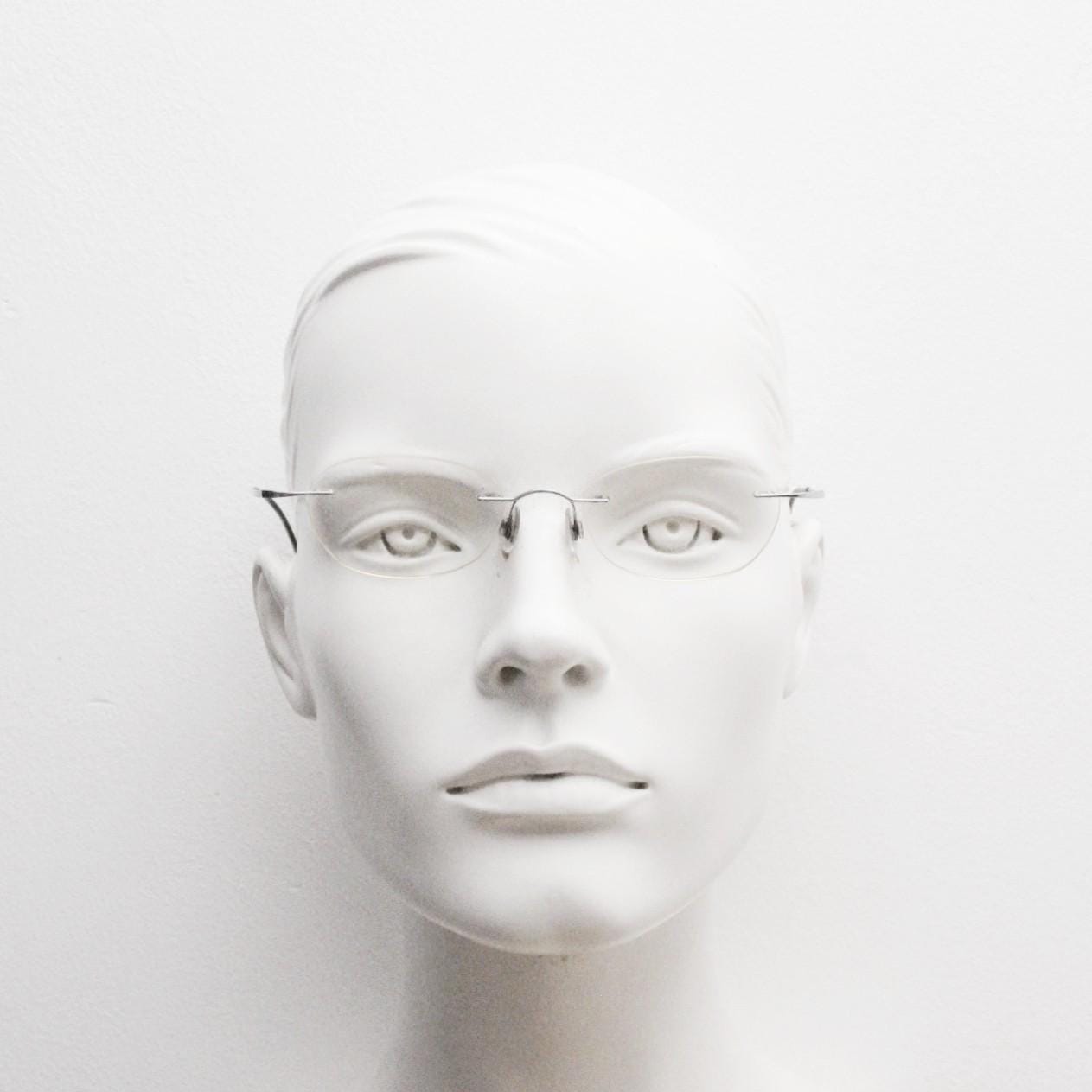 Silhouette frameless oval eye glasses. Extremely minimal lightweight titanium optical frame with springy hingeless arms. 2000s Vintage