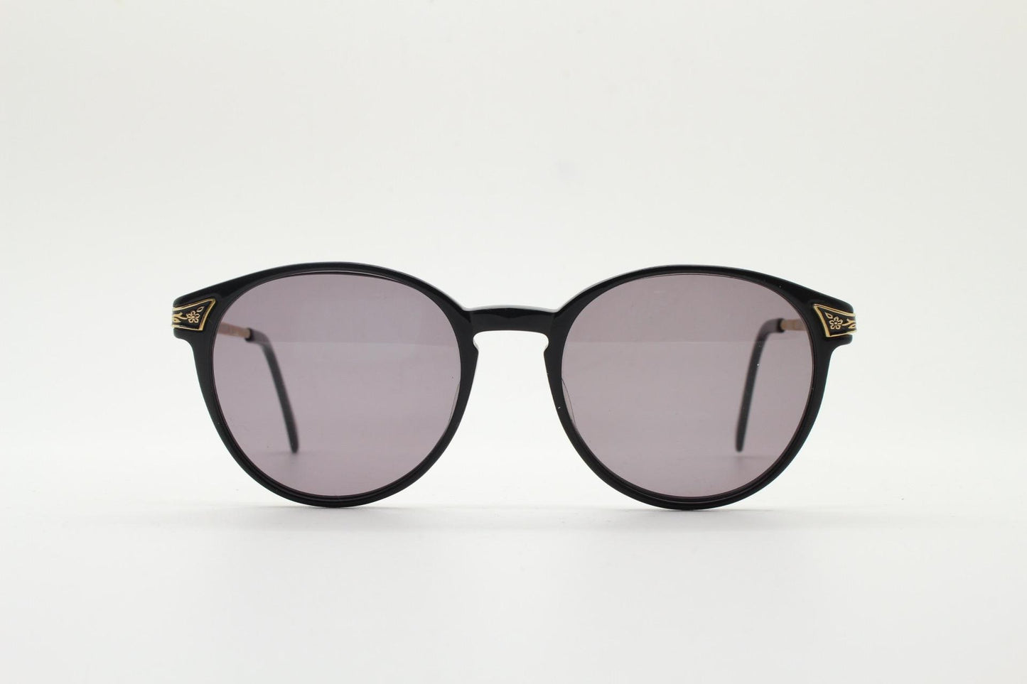 Laura Ashley 90s vintage round sunglasses. Refined 1940s design in black acetate with ornate embossed metal arm details. Unused NOS