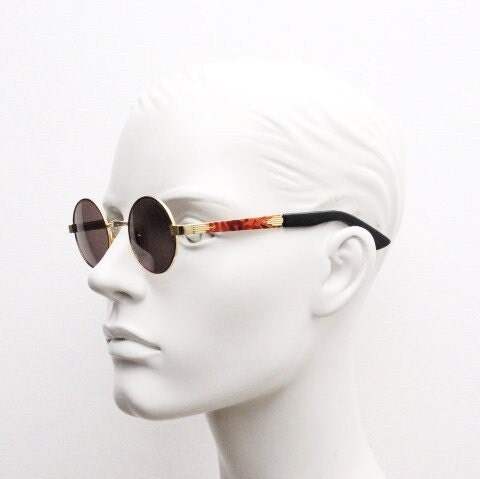 Optical City 90s vintage small round undersized sunglasses made in Italy. Handsome metallic tiger pattern on quality 1920s repro frame. NOS