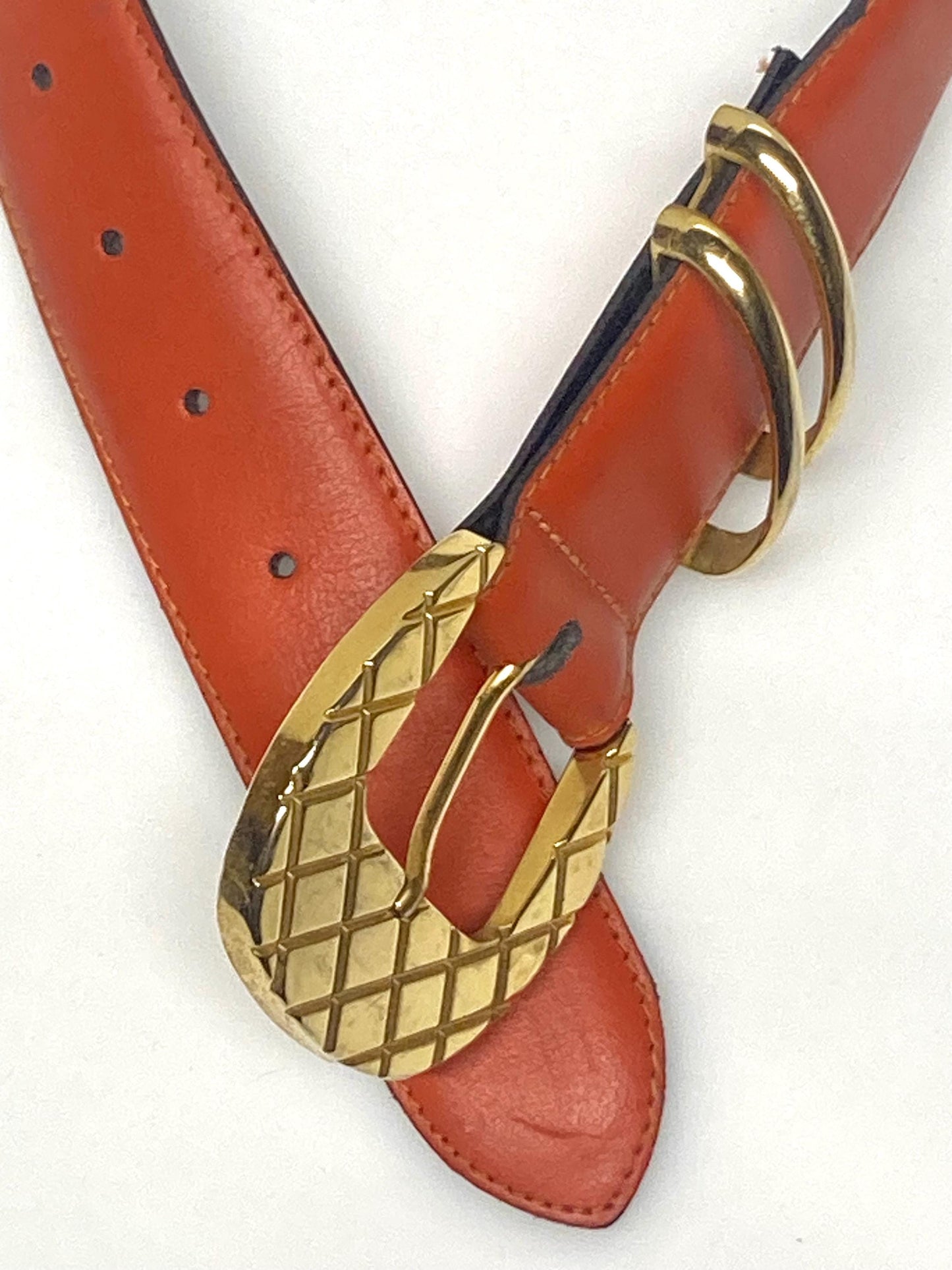 80s vintage womens dress / jeans belt in bright orange leather with golden metal squares. Made in France. Used in good condition