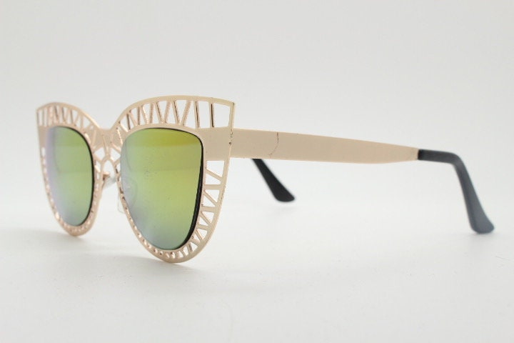 Y2K vintage metal cat eye sunglasses. Women's extraordinary gold cut out lattice scaffold cateye frame with gold mirror lenses. 2000s. BNWT