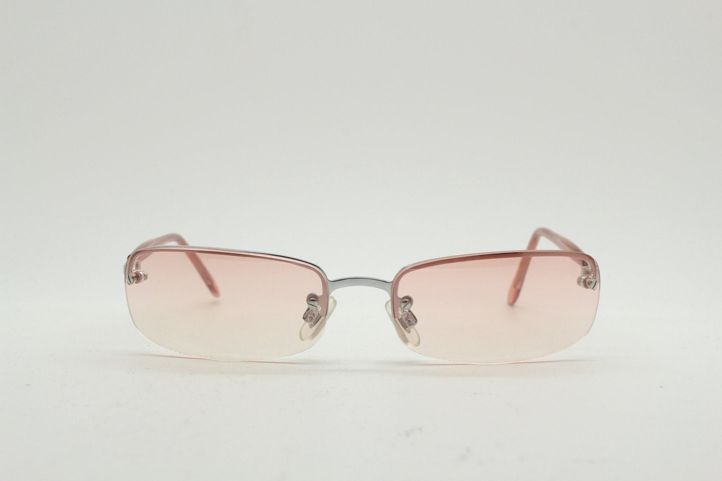 Y2K vintage wrap around rectangular sunglasses. Half frame in sharp chrome with extra light tone pink lenses. Rave 2000's. 00's NOS