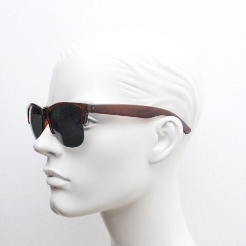 90s vintage modified wayfarer design sunglasses. Transparent brown browline half frame with brown or green interchangeable lenses . NOS