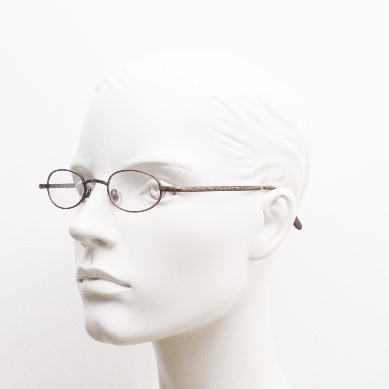 Paris Ma 90s vintage small oval eye glasses. Brushed copper finish optical frames with ornate details. Prescription steampunk spectacles NOS