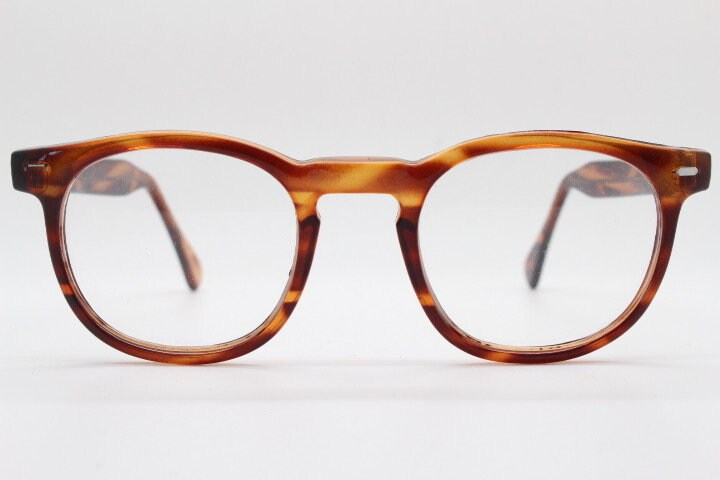 80s vintage modified wayfarer style glasses. Tortoise optical frames with keyhole bridge and clear lenses. 40s, 50s style NOS eyeglasses