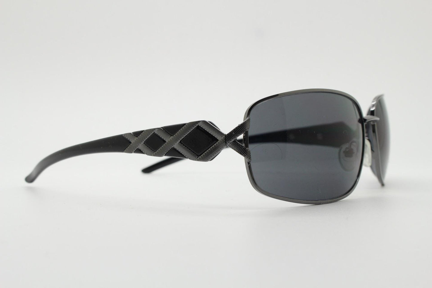 2000s vintage rectangular bug eye sunglasses. Solid metal slightly oversized grey chrome frame with diamond lattice arm detail. Y2K NOS