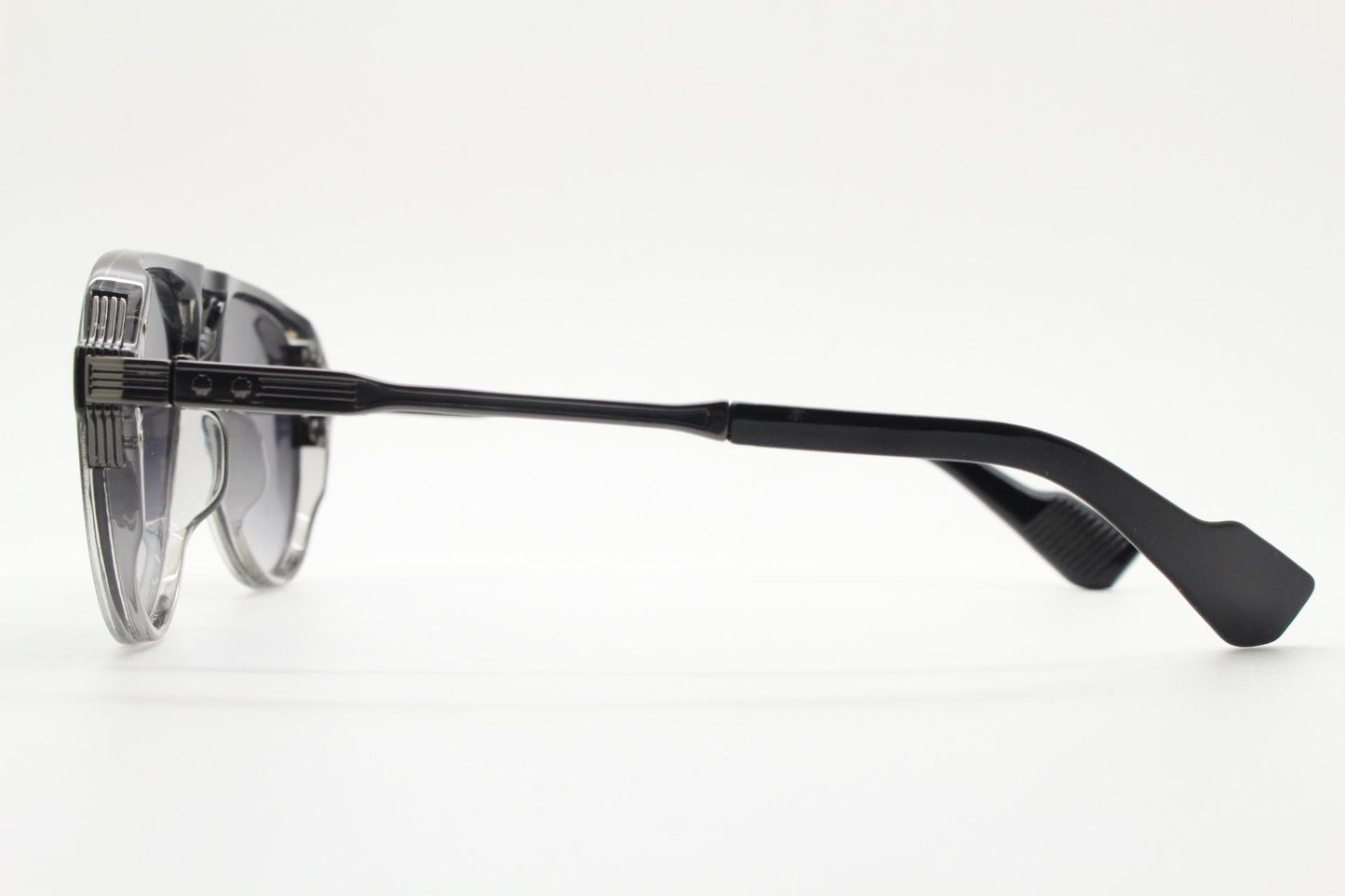 Y2K vintage transparent black aviator sunglasses. Well proportioned teardrop shape with graduating lenses and grey metal embossed arms. NOS