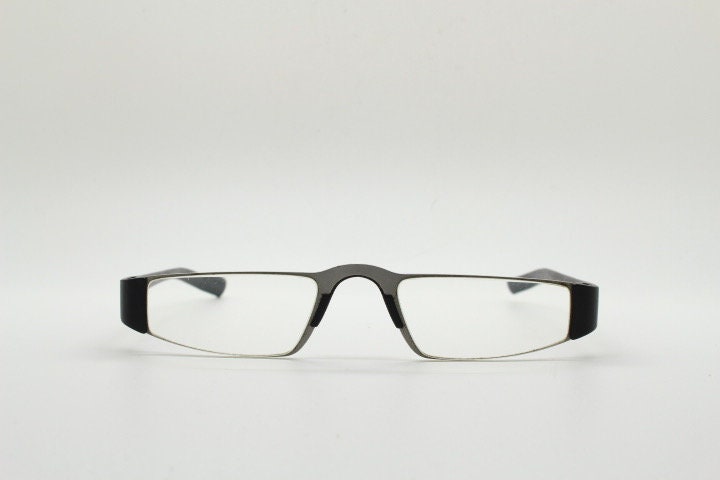 Porsche design rectangular eye glasses. Minimal grey metal optical frame in a matt finish with black arms. Vintage Prescription spectacles