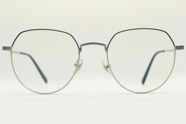Bolon round panto flat top eye glasses model 7052. Slender silver metal optical frame with black brow. Prescription spectacles. Vintage RX