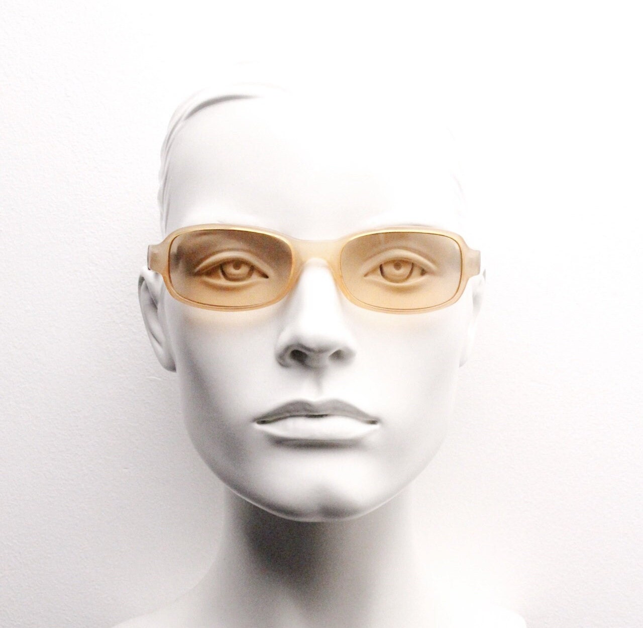 Y2K vintage curved rectangular sunglasses. Beige frame with matching lenses and contrasting tortoise arms. 2000s unused NOS. 00s