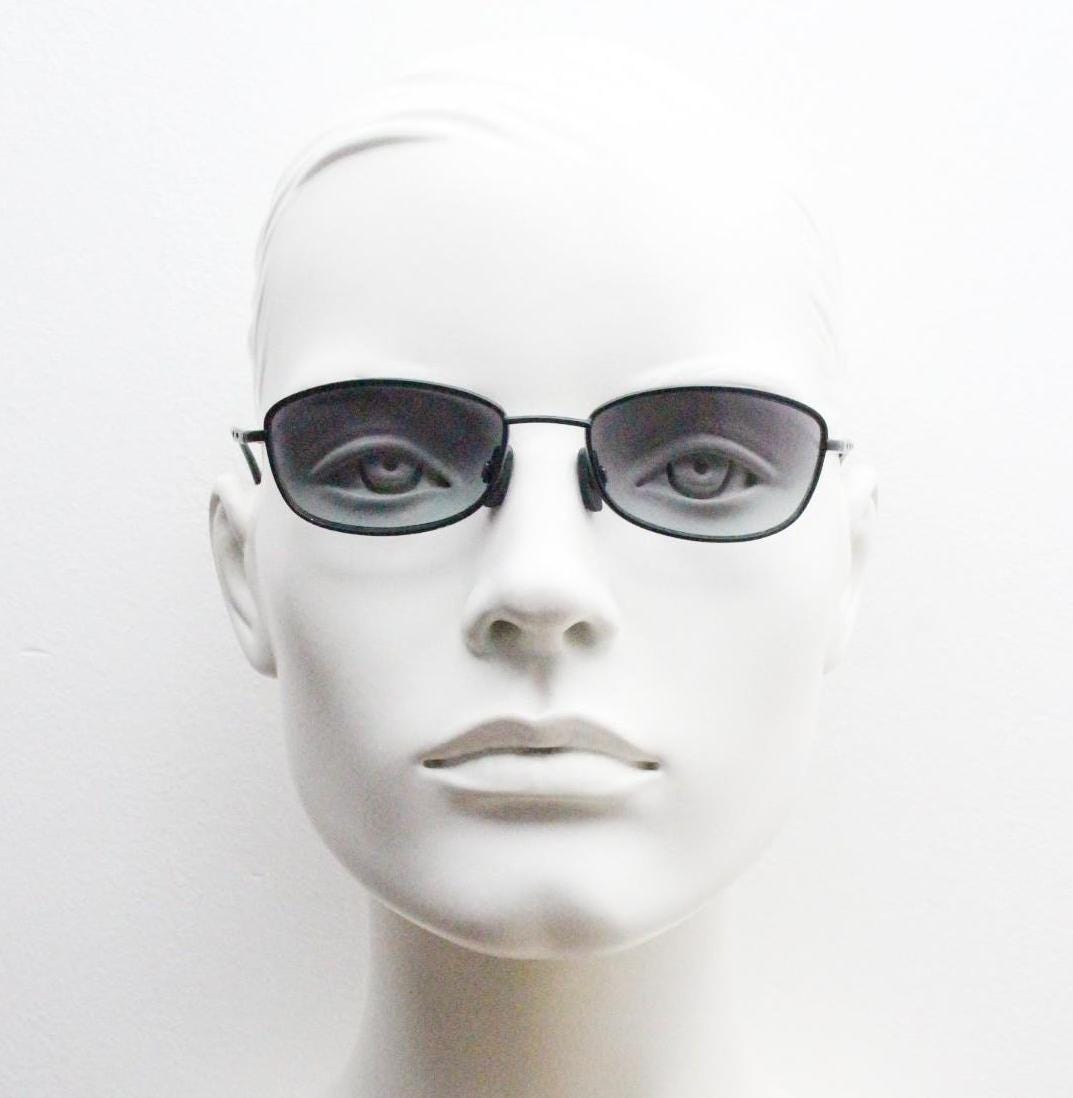 90s vintage curved rectangular sunglasses. Solid metal low profile black matt finish frame with slightly graduating lenses. 2000's. Y2K. NOS