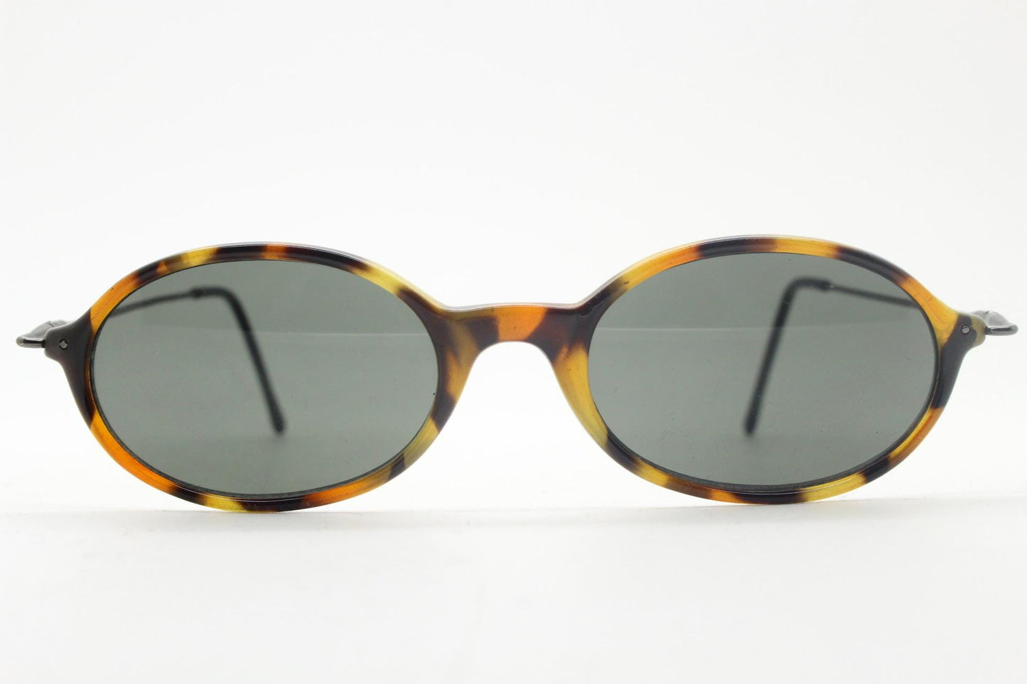 90s vintage oval sunglasses. Honey tortoise frame with refined slim 'industrial tech' style arms. Micro. Unused NOS