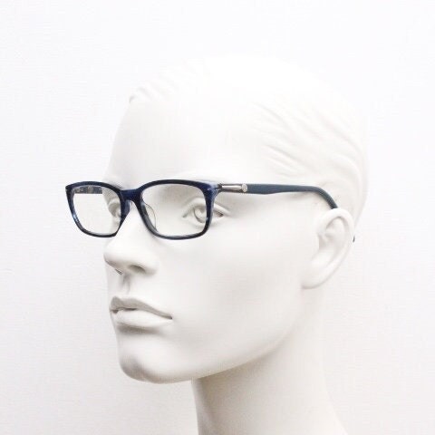 Calvin Klein rectangular low profile eye glasses. Dark navy blue gloss acetate optical frames. Prescription eyeglasses. RX