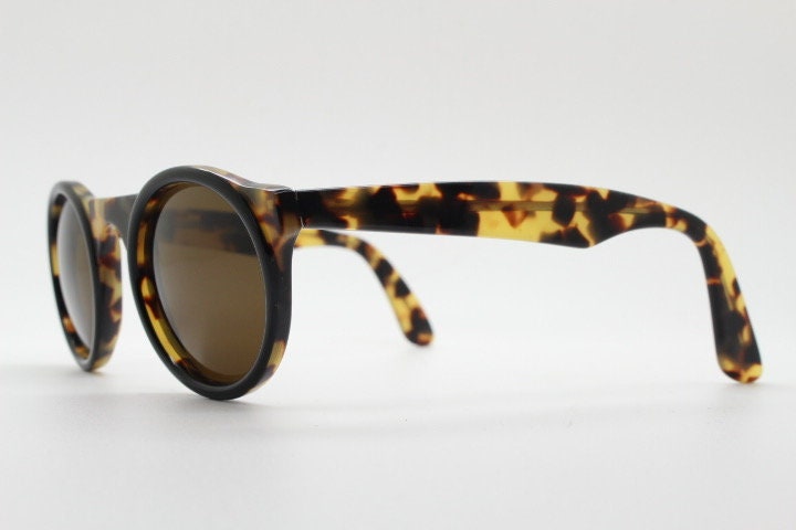 Francois Pinton Paris 90s vintage round sunglasses made in France. Womens thick acetate frame in honey tortoise brown tones. NOS