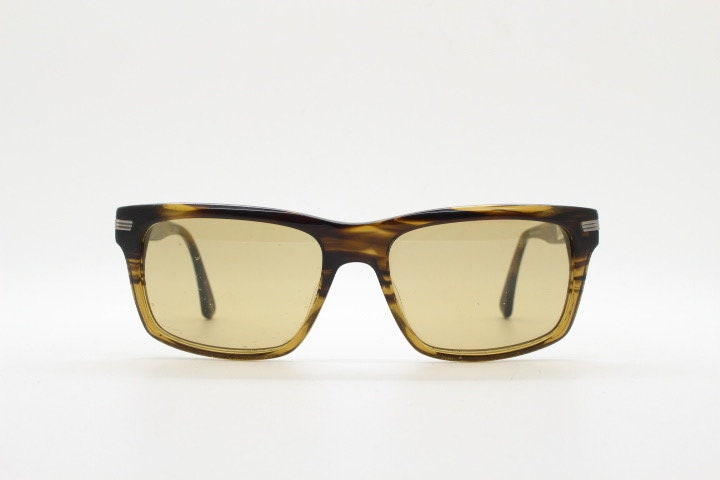 Oliver Peoples vintage rectangular sunglasses model Maceo. Handsome transparent mottled honey brown acetate frame with mid tone lenses