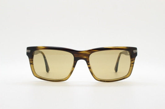 Oliver Peoples vintage rectangular sunglasses model Maceo. Handsome transparent mottled honey brown acetate frame with mid tone lenses