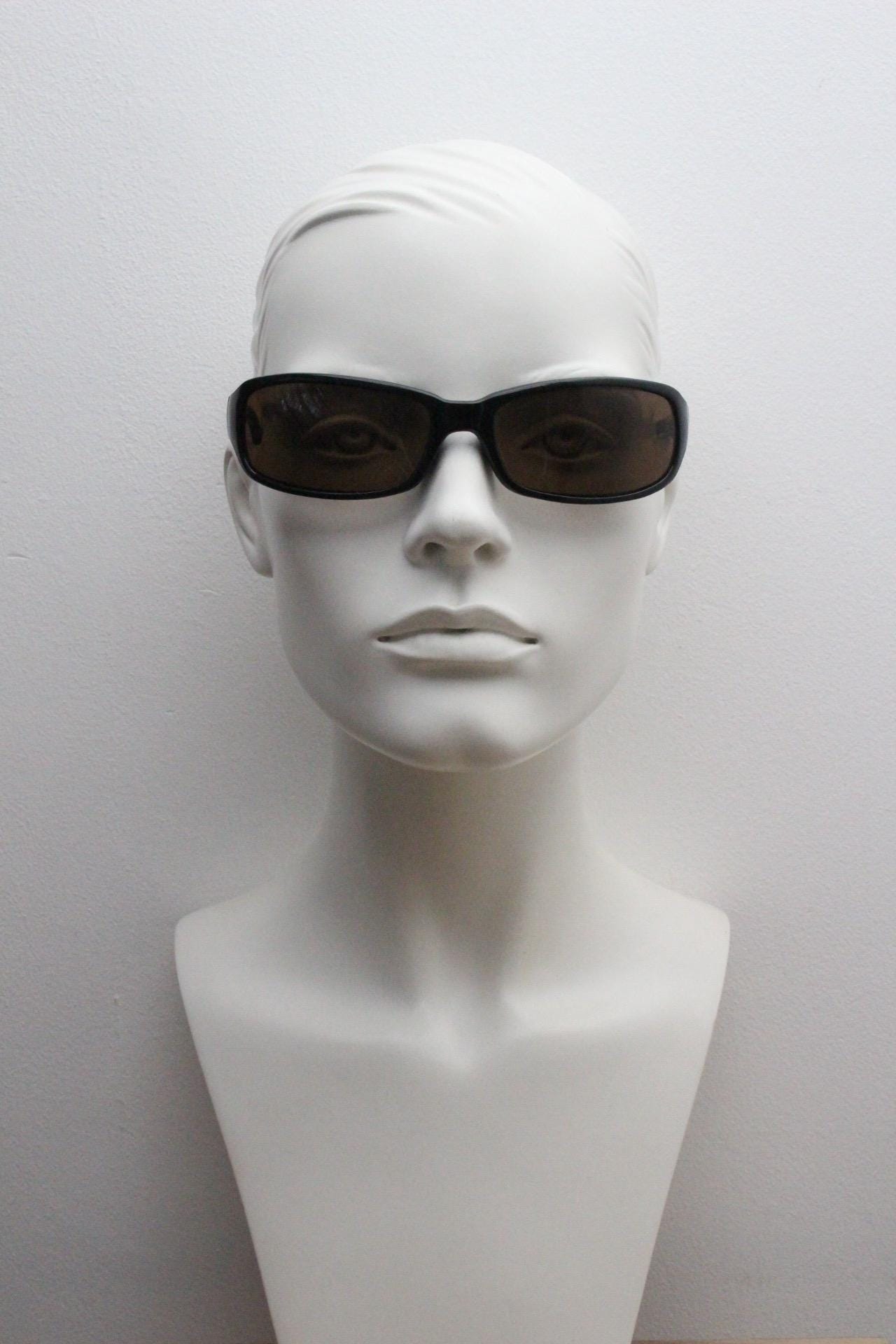 Y2k vintage wrap around rectangular sunglasses. Low profile curved black gloss frame with plain brown lenses. 2000's bug eye. NOS