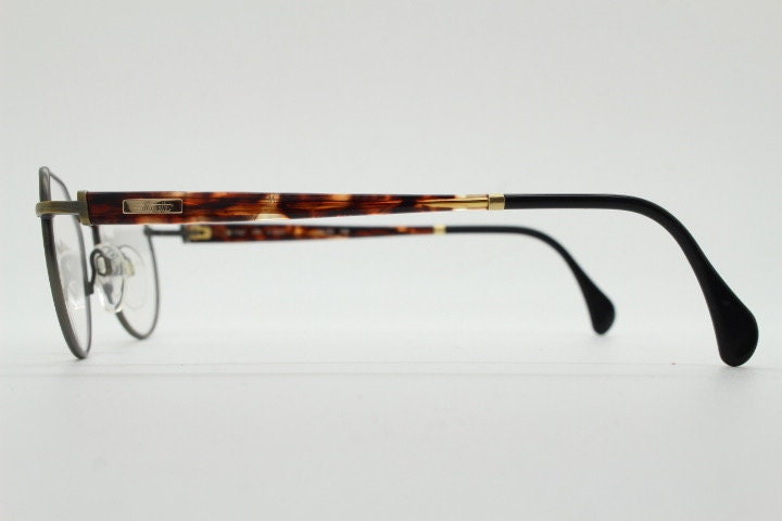 Silhouette vintage 90s flat top oval eye glasses made in Austria. Satin bronze optical frame with honey tortoise trim. Prescription RX