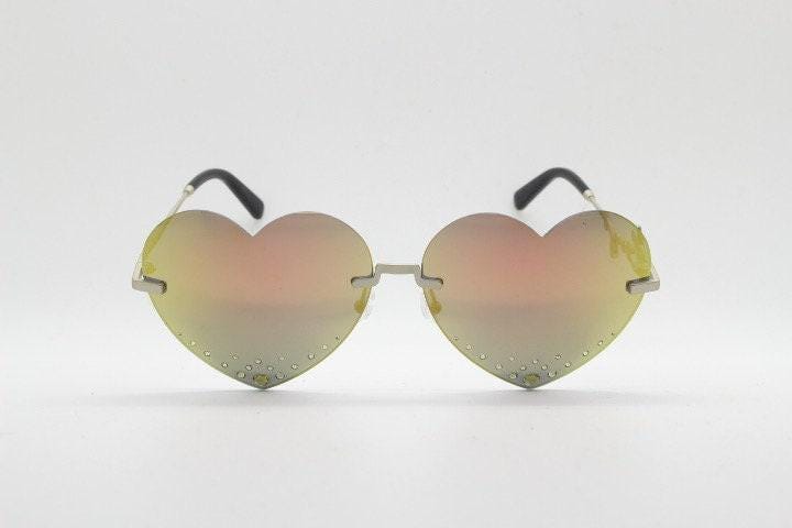 Kenzo mirror heart shaped frameless sunglasses model KZ40005U. Instant classic design with diamantes and big spell out arm logo. NOS