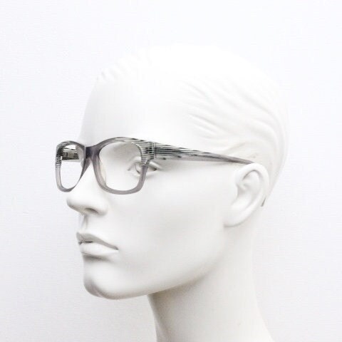 Alain Mikli rectangular eye glasses made in France. Dynamic black and white striped layered acetate grey optical frame. Prescription RX