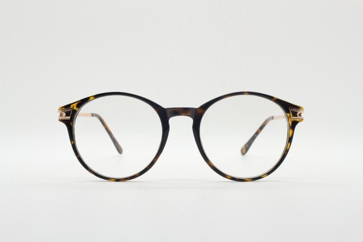 90s vintage round glasses with tortoise front and gold embossed arms. 40s, 50s style prescription optical frames. Clear lens eyeglasses. RX