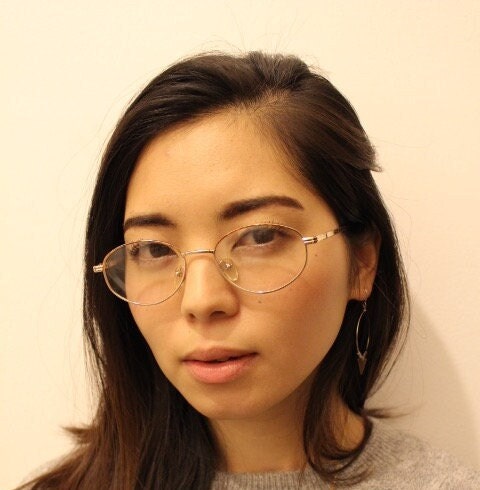 90s vintage oval eye glasses. Bright golden optical frames with coloured enamel brows. Prescription RX spectacles. Clear lens NOS