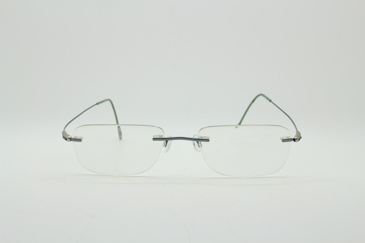 Silhouette rectangular frameless eye glasses model 7554 made in Austria. Minimal lightweight titanium optical frame. Prescription RX