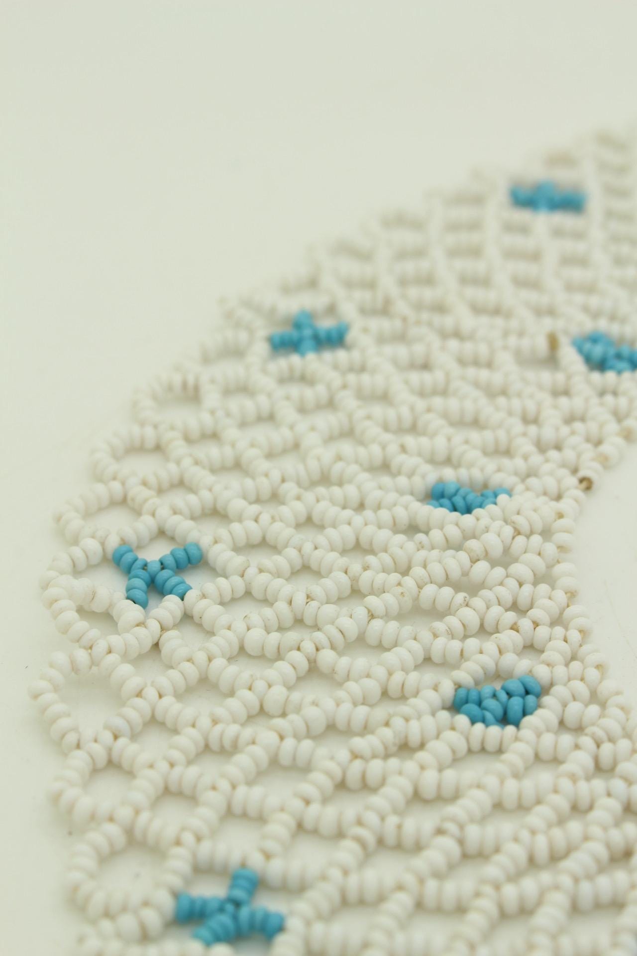 80s vintage beaded lattice collar necklace. Small white beads mixed with blue "x" patterns. Womens large versatile choker. Unused NOS