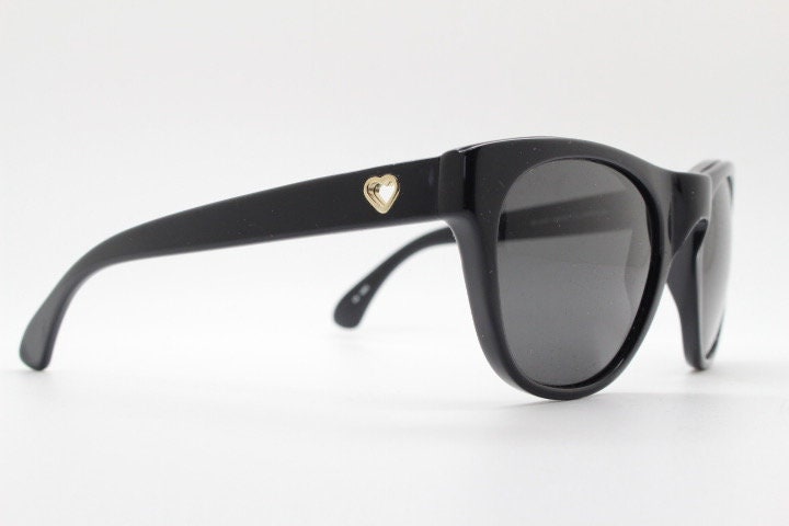Linda Farrow Collaborations sunglasses with LUELLA. Limited production black acetate chunky wayfarer design with heart crests. NOS vintage