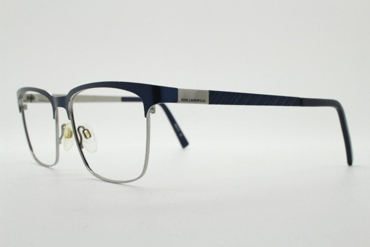 Karl Lagerfeld squared wayfarer shape eye glasses. Navy check pattern arms with satin finish brow optical frames. Prescription eyeglasses.