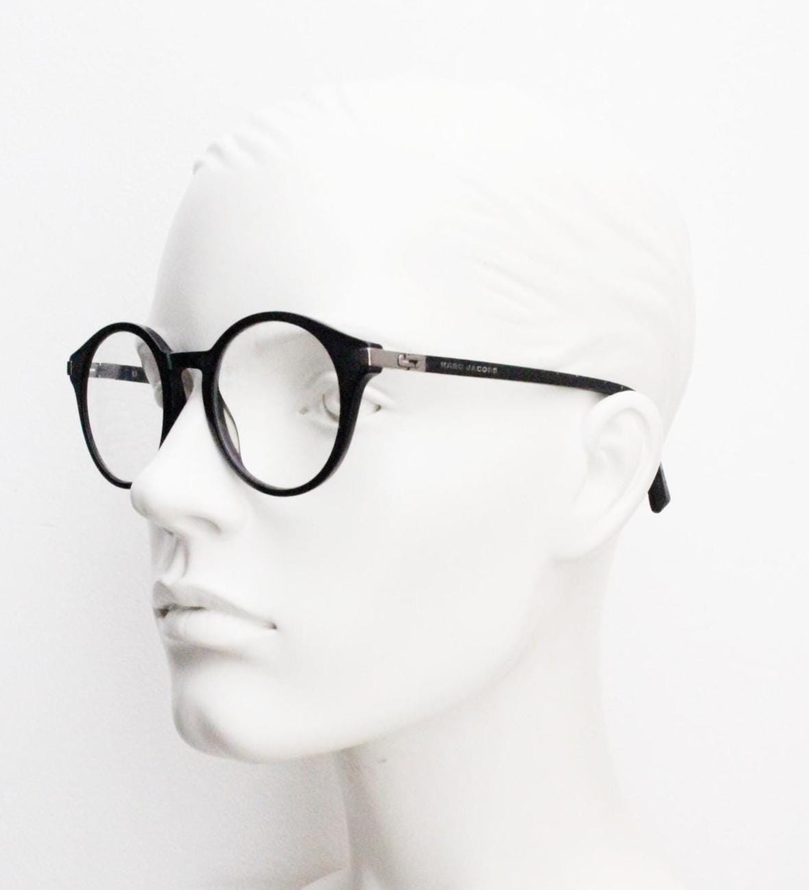 Marc Jacobs round eye glasses in plain black satin finish acetate. Strong fashion look optical frames. Prescription RX spectacles