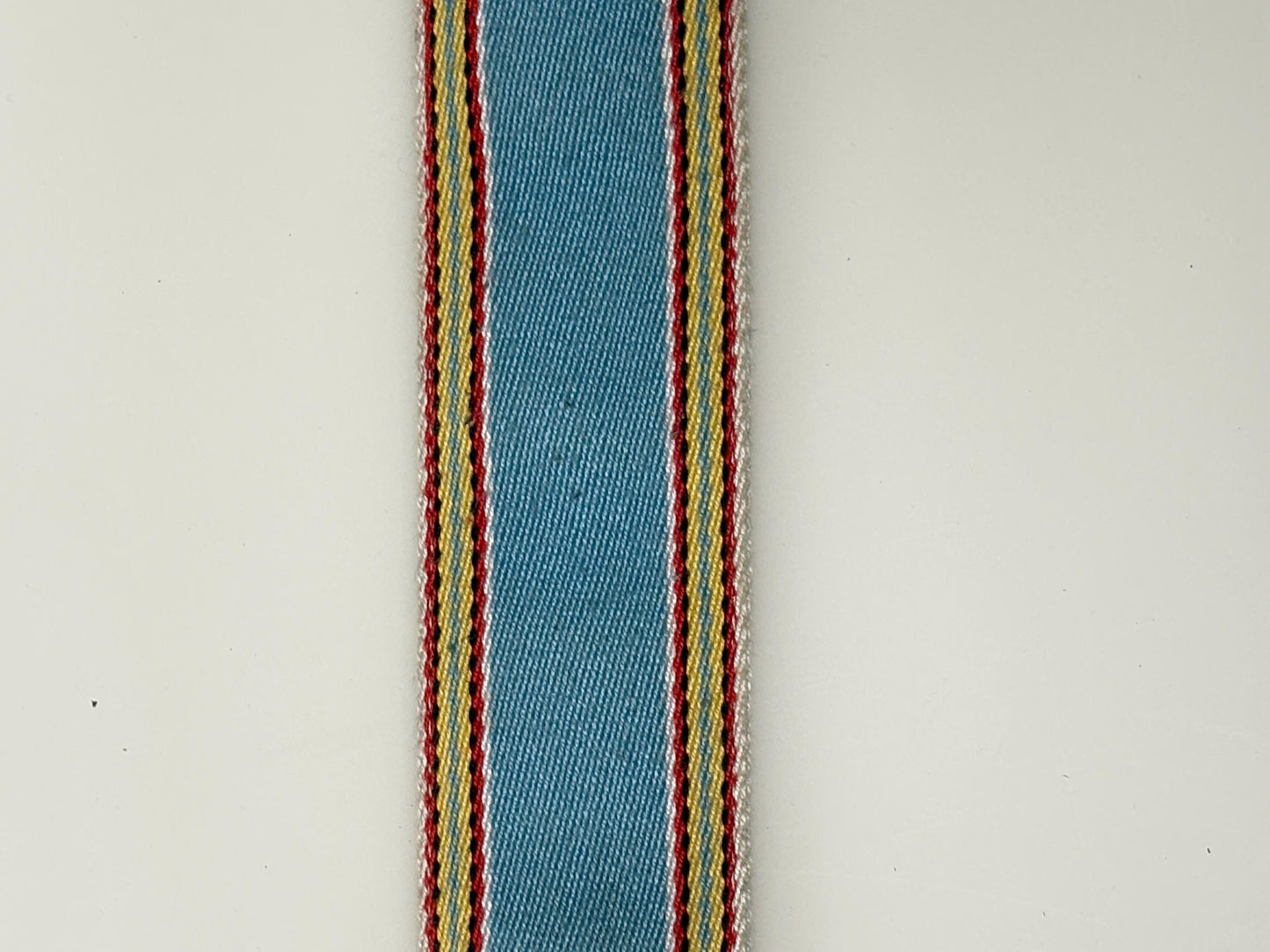 Y2K vintage 2' canvas army style belt in sky blue with red, white and yellow rainbow stripes. 2000s Mens large. Fully adjustable size range