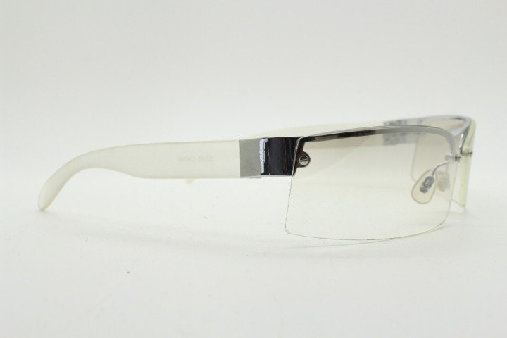 Y2K vintage wraparound sunglasses. Sick fashion grail half frame in silver chrome with extra light tone curving mirrored lenses. 2000's NOS
