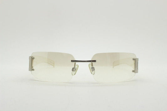 Y2K vintage wraparound sunglasses. Minimal frameless light tone curved mirrored lenses with silver chrome trim. 2000's. 90s. 00s. NOS