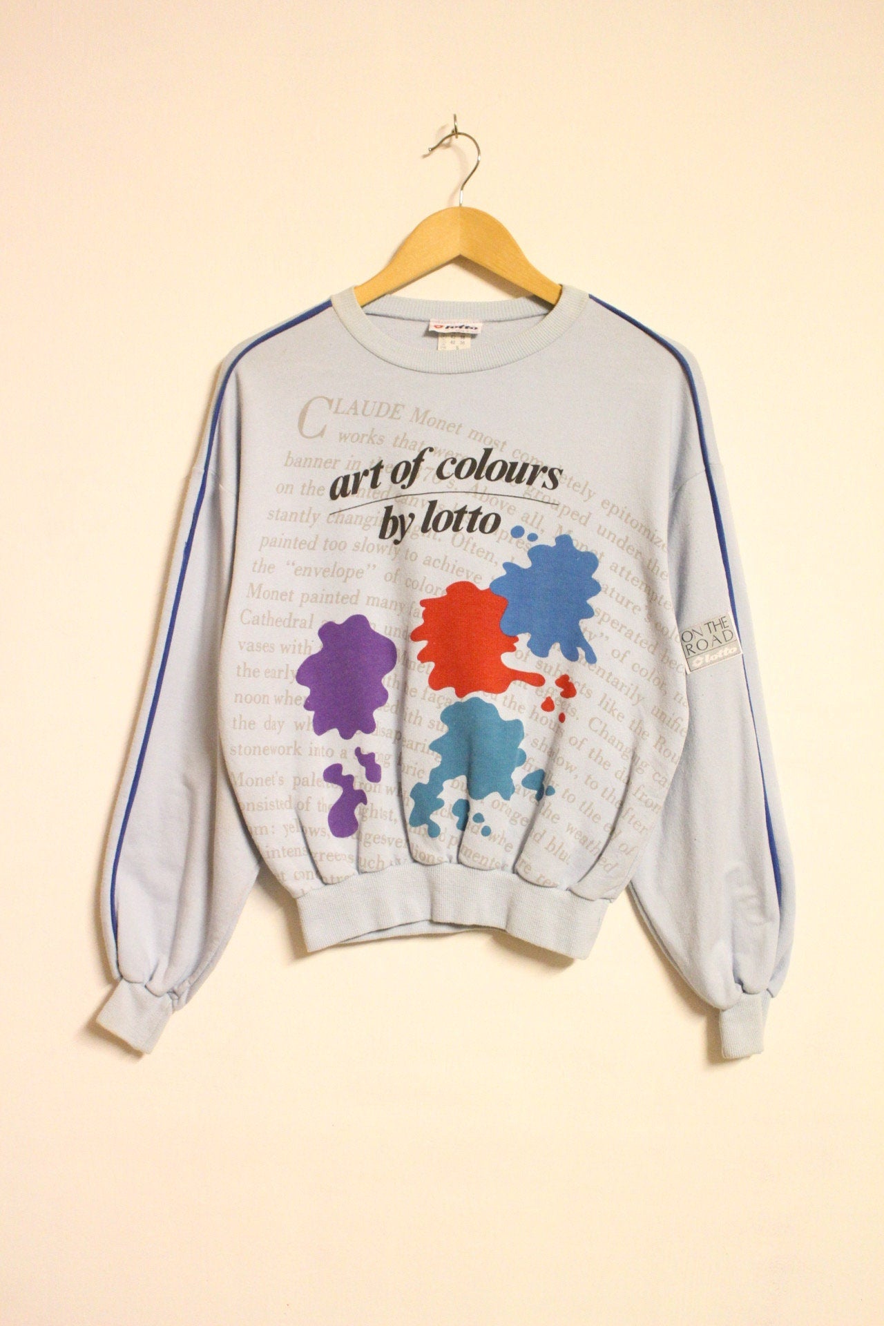 Vintage 80s blue sweatshirt by Lotto with 'art of colours' paint splash graphic. Made in Italy.