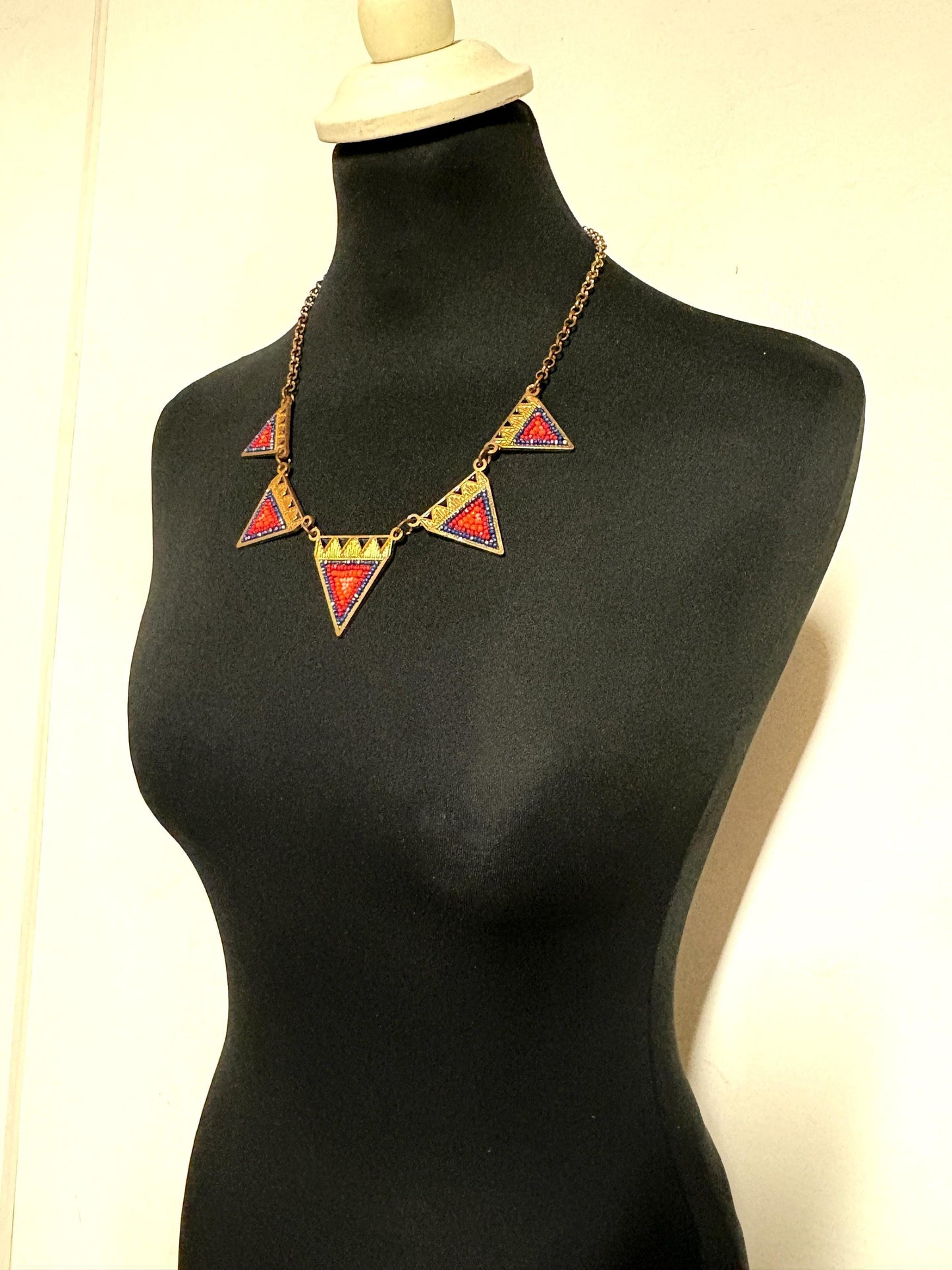 80s vintage gold triangles necklace. Aztec style with multi coloured bead inlays and ornate patterns. Womens statement design