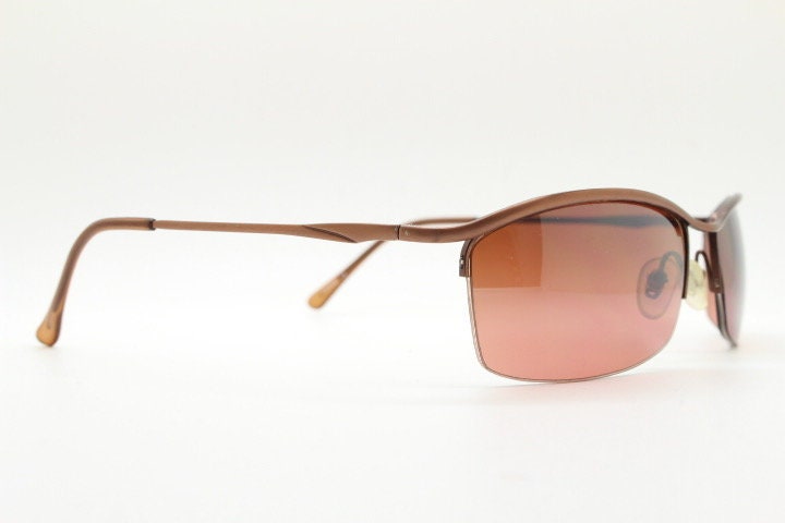Y2K vintage curved rectangular sunglasses. Minimal half frame brow line design in brown satin finish with mid tone lenses. 2000's. 00's NOS