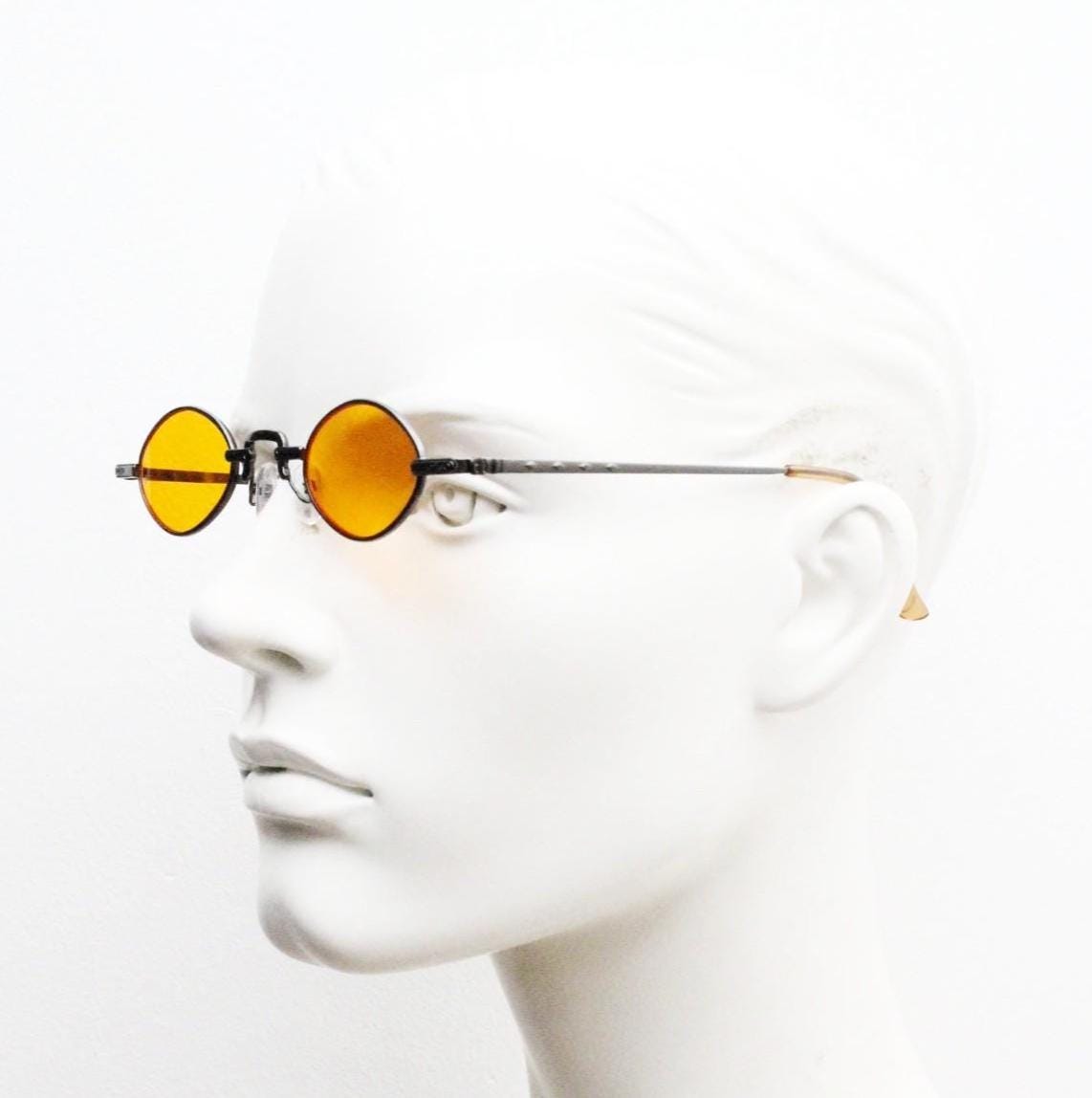 90s vintage small oval sunglasses. Imposing minimal rose gold metal victorian style frame with blazing orange lenses. Steampunk. BNWT