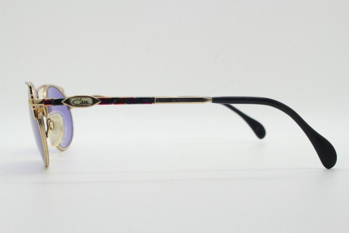 Cazal 90s vintage sunglasses made in Germany. Dynamic multi colour enamelled frame with custom ordered unique purple lenses