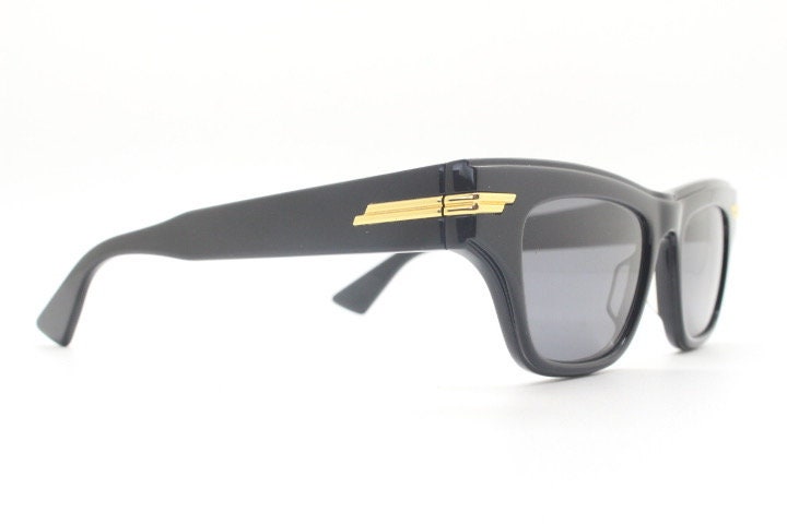 Bottega Veneta thick flat top cat eye sunglasses made in Japan. Black gloss acetate frame with sharp cropped sides. Womens cateye. BNWOT