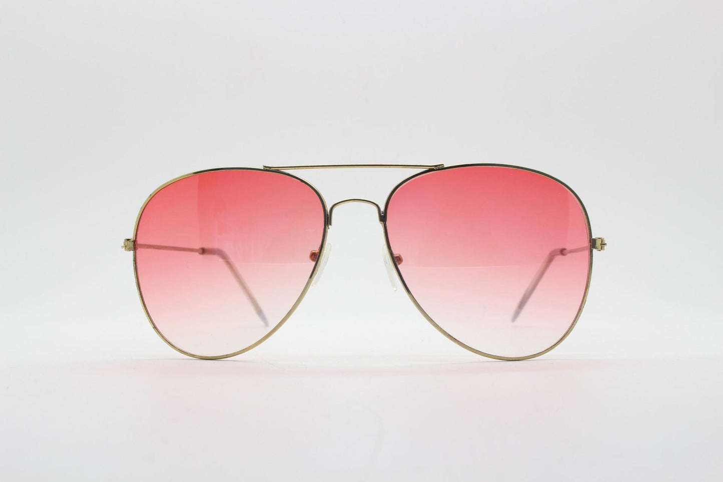 Y2K vintage aviator sunglasses. Gold metal frame pilot aviators with atmospheric light pink gradient lenses. Teardrop. 70s. 2000s. 00s NOS
