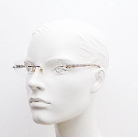 Vogue vintage frameless oval eye glasses. Transparent acetate arms with purple and green tones. Minimal Prescription RX Optical frame