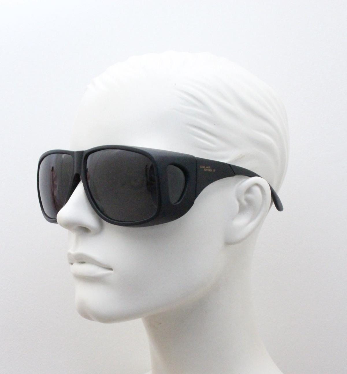 80s vintage massive oversized shield goggle sunglasses with side windows. Big black matt wrap around frame with grey lenses