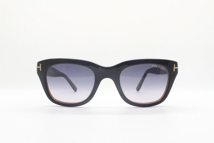 Tom Ford vintage modified wayfarer sunglasses made in Italy. Slightly cat eye form in black gloss acetate with superb graduating lenses