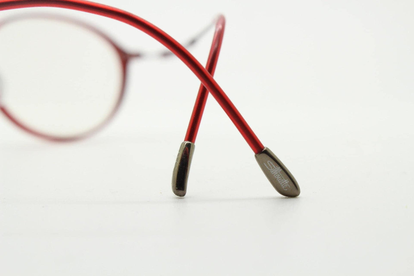 Silhouette rectangular frameless eye glasses made in Austria. Lightweight 1930s design with titanium. Red optical frame. Prescription RX