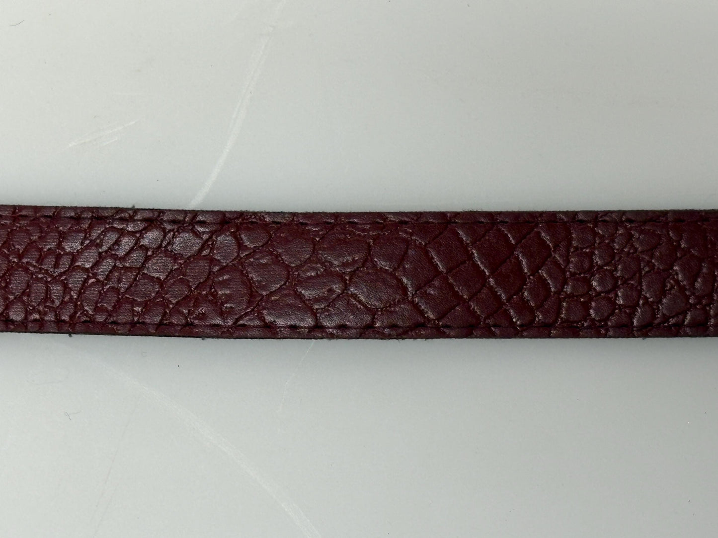 80s vintage womens embossed crocodile pattern 1" belt for jeans or trousers. Eco leather red vinyl with silver chrome buckle. Vegan