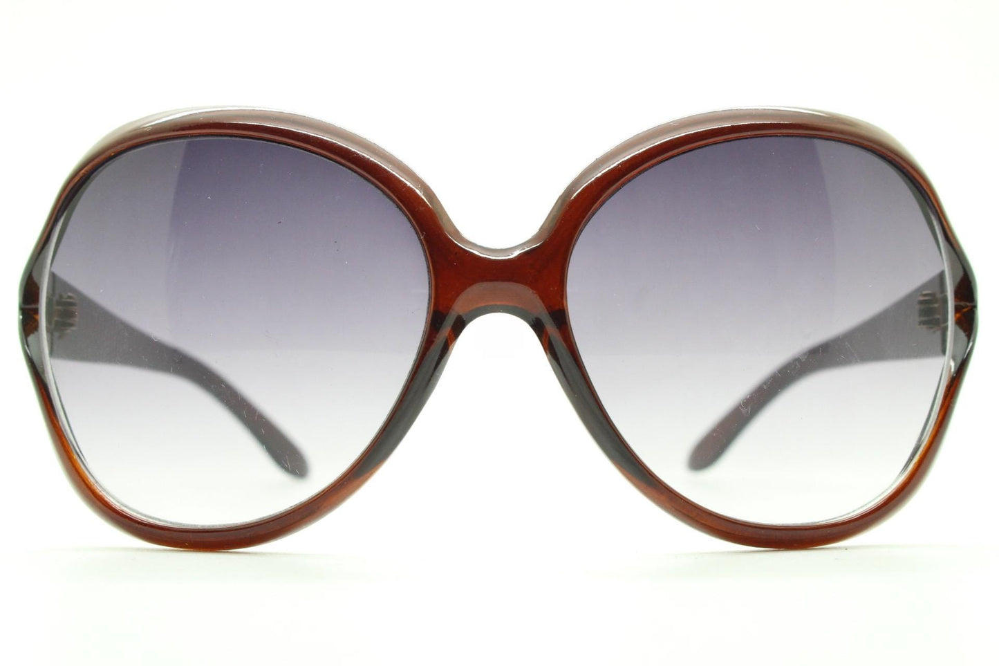 Y2K vintage big round angular sunglasses. Women's 70s design in transparent brown with graduating lenses and forked side detail. 2000s NOS