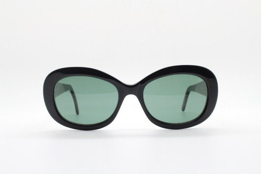 Calvin Klein vintage oval cateye sunglasses made in Italy. Womens plain black gloss thickened acetate cat eye. Classical 60s design. Y2K