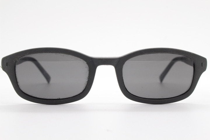 Dolce and Gabbana gum sunglasses made in Italy. Mens 90s vintage innovative flexible grey rubber frame with black lenses